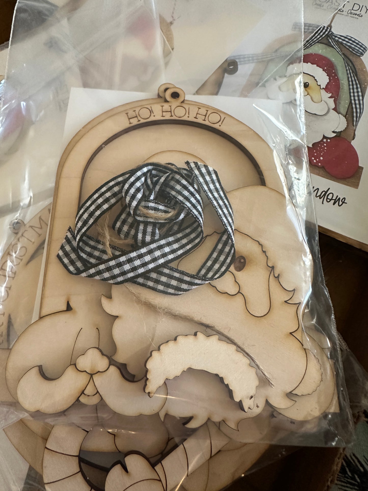 Santa leaning out window ornament