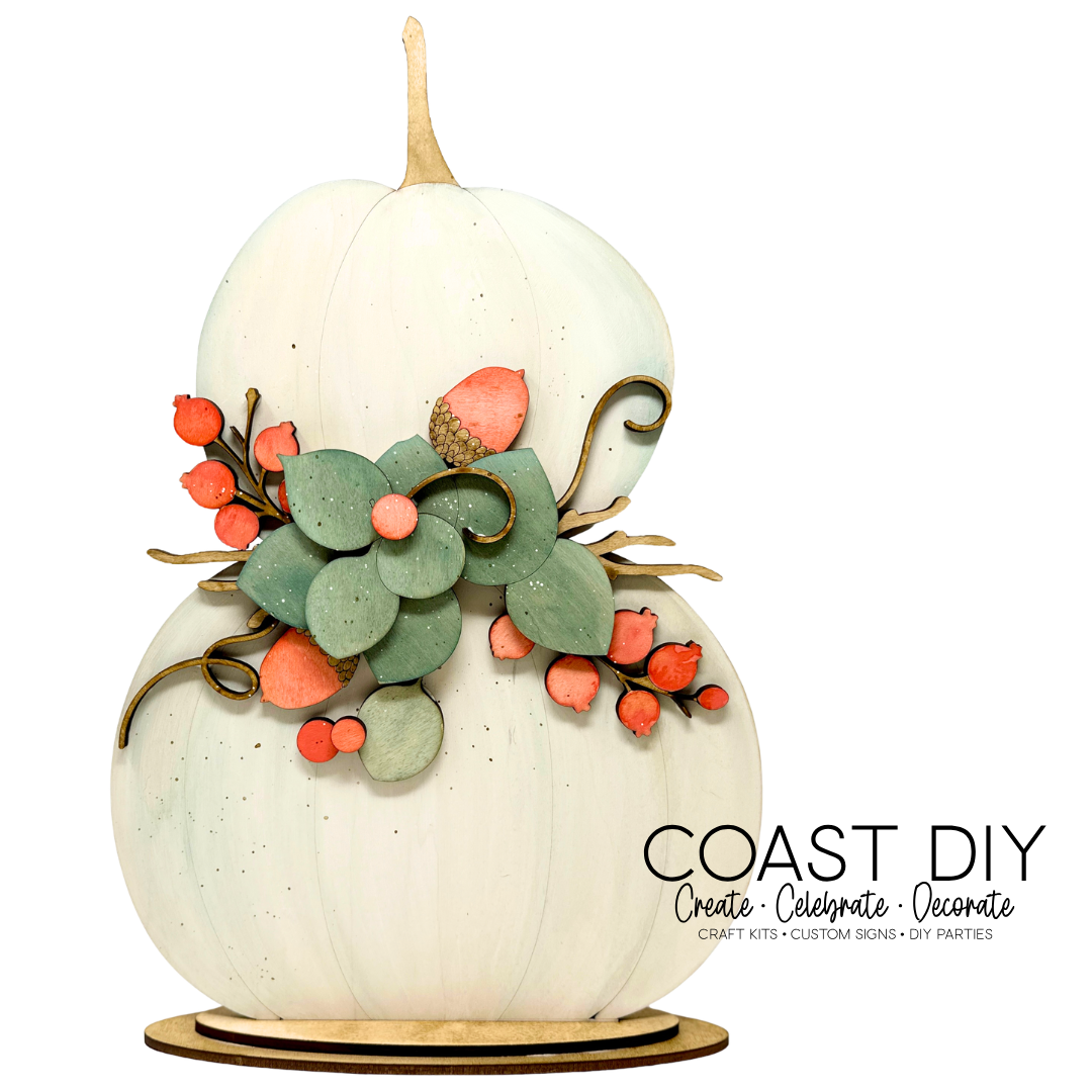Stacked Pumpkins with Berries and Eucalyptus