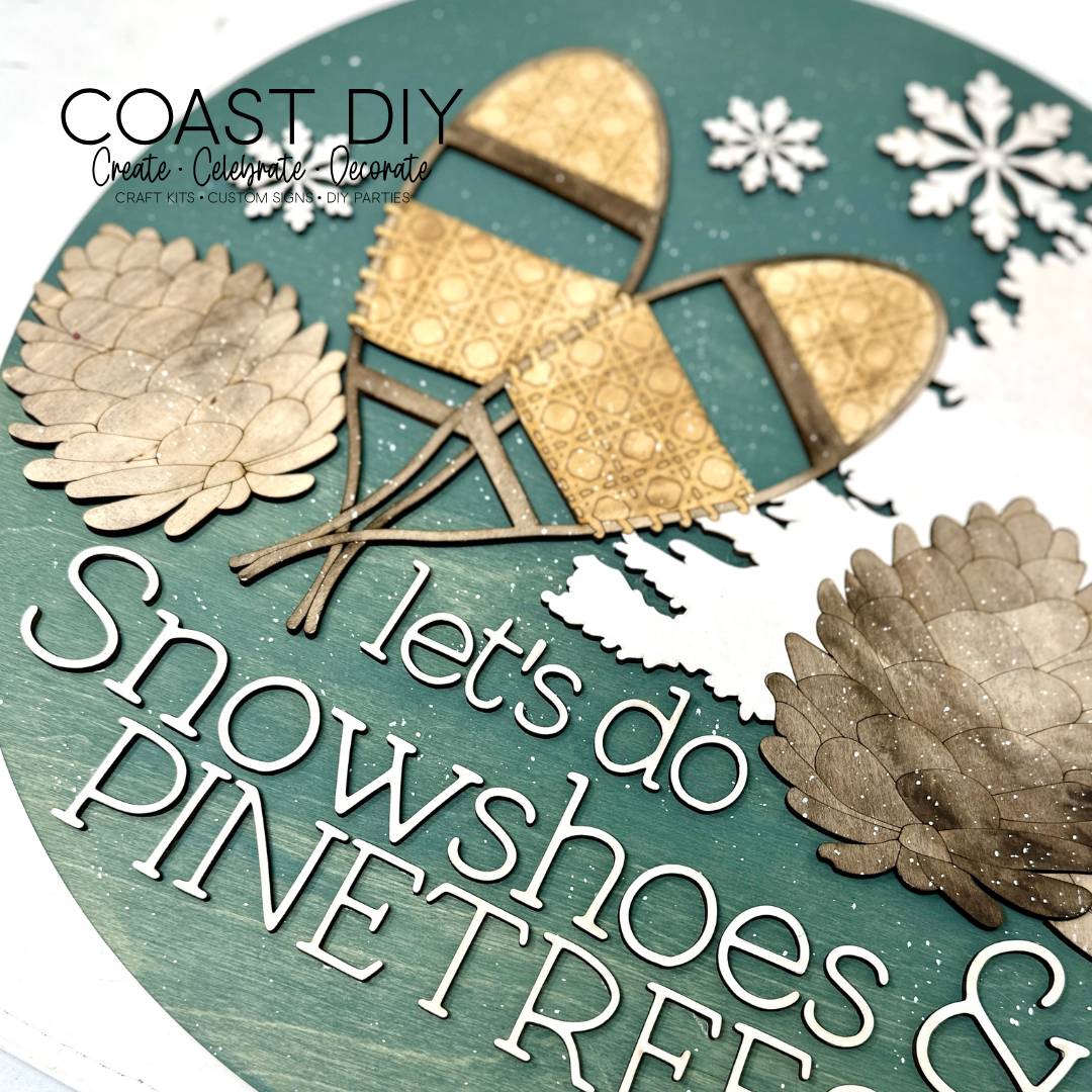 Snowshoes and Pinecones Doorhanger