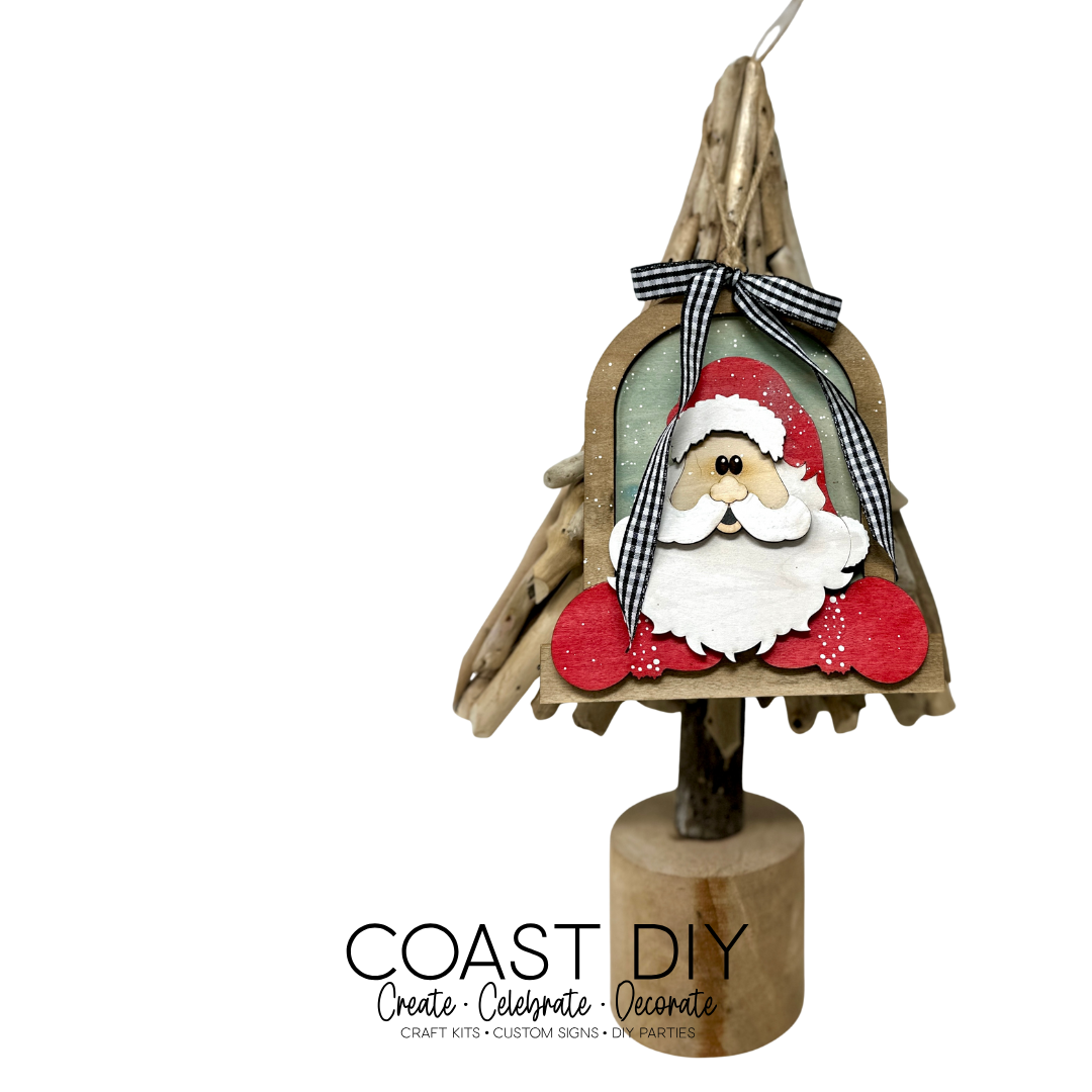 Santa leaning out window ornament